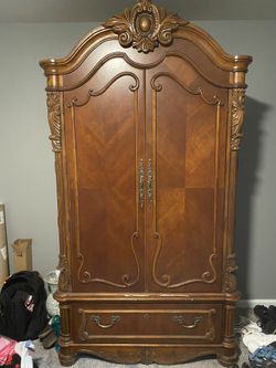 Very sturdy, heavy wood armoire piece. Perfect for tv, bedding, clothing etc. Few scratches from movers as shown in pics.