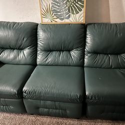 Giving away a green leather/vinyl reclining sectional couch for FREE. It’s still comfortable and functional and would be great for a living Space 