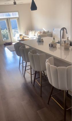 white and gold barstools
