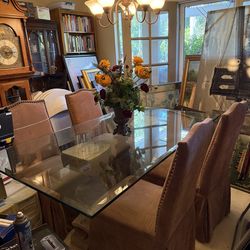 Glass top dining table with four dining chairs
