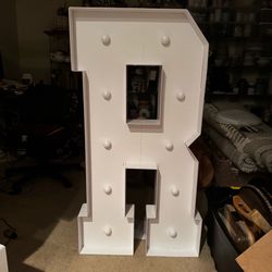 4-foot tall white marquee letter "R"