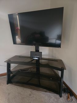 50 inch smart tv, clock and tv stand