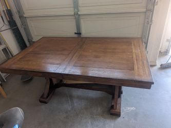 Solid wood dining table fits 6, expanding to 8