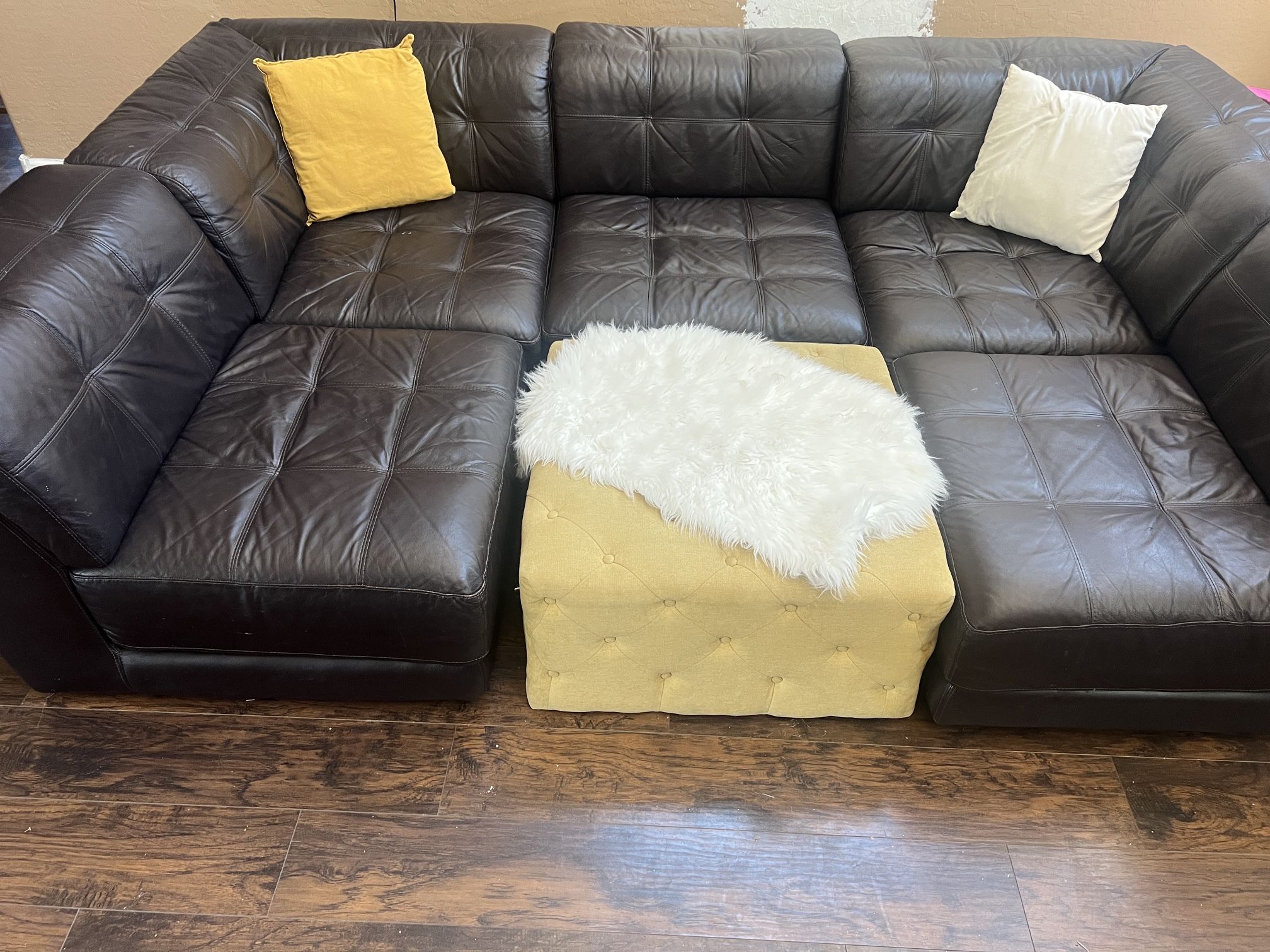 Leather Sectional And Two Book Shelves