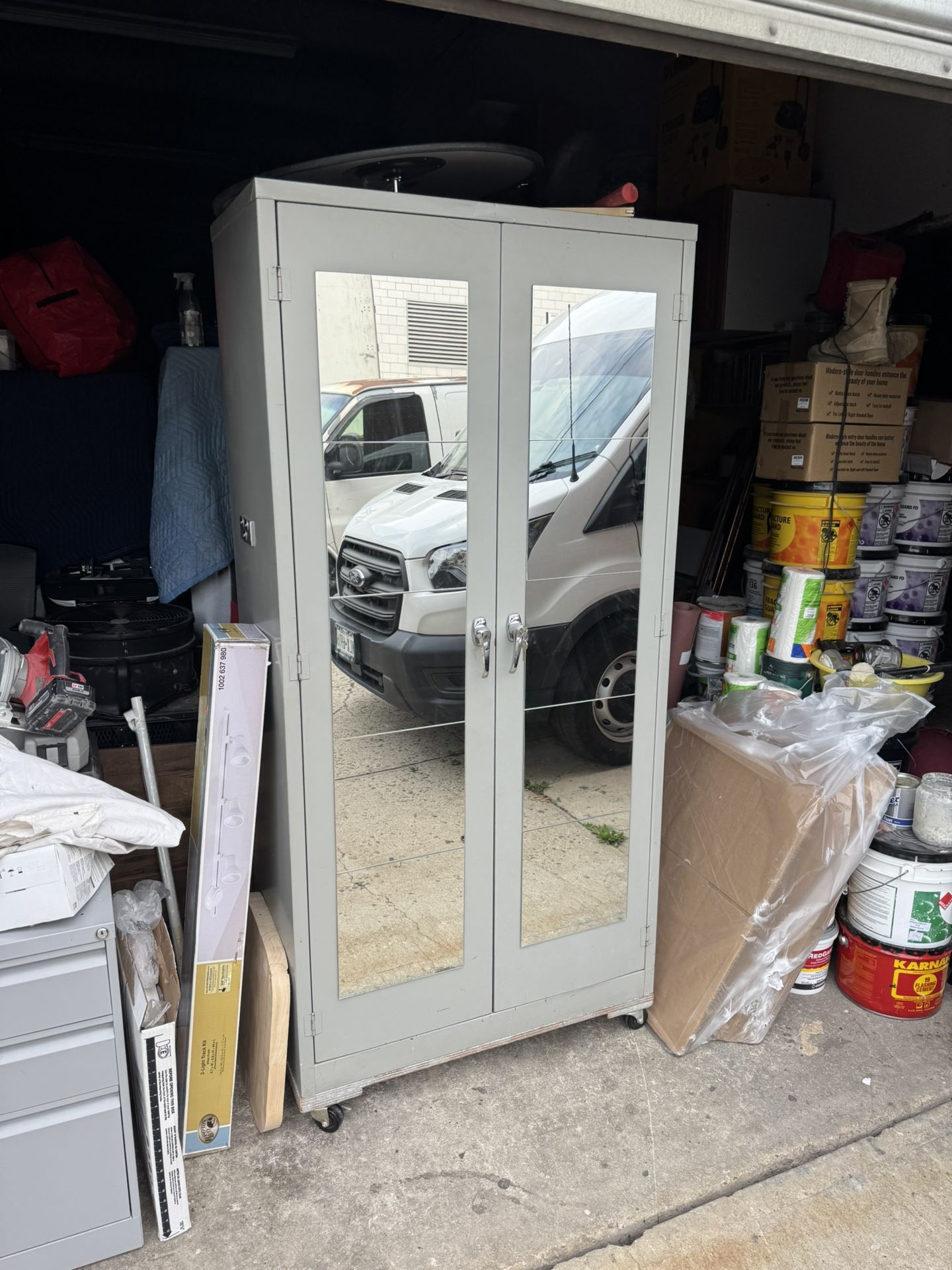 36” Metal wardrobe closet with a lock 2 shelves with a rod and on wheels