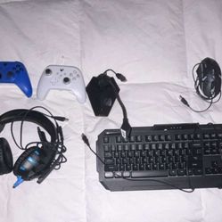 blue, white, and black xbox controllers, keyboard, mouse, mic, headset