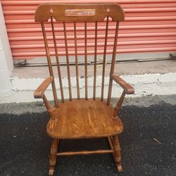 Wood Rocking Chair With Clemson Plaques On It