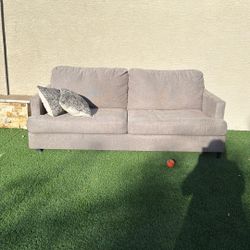 Free couch. One leg is broken.