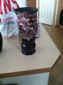 Purple flower/black vase