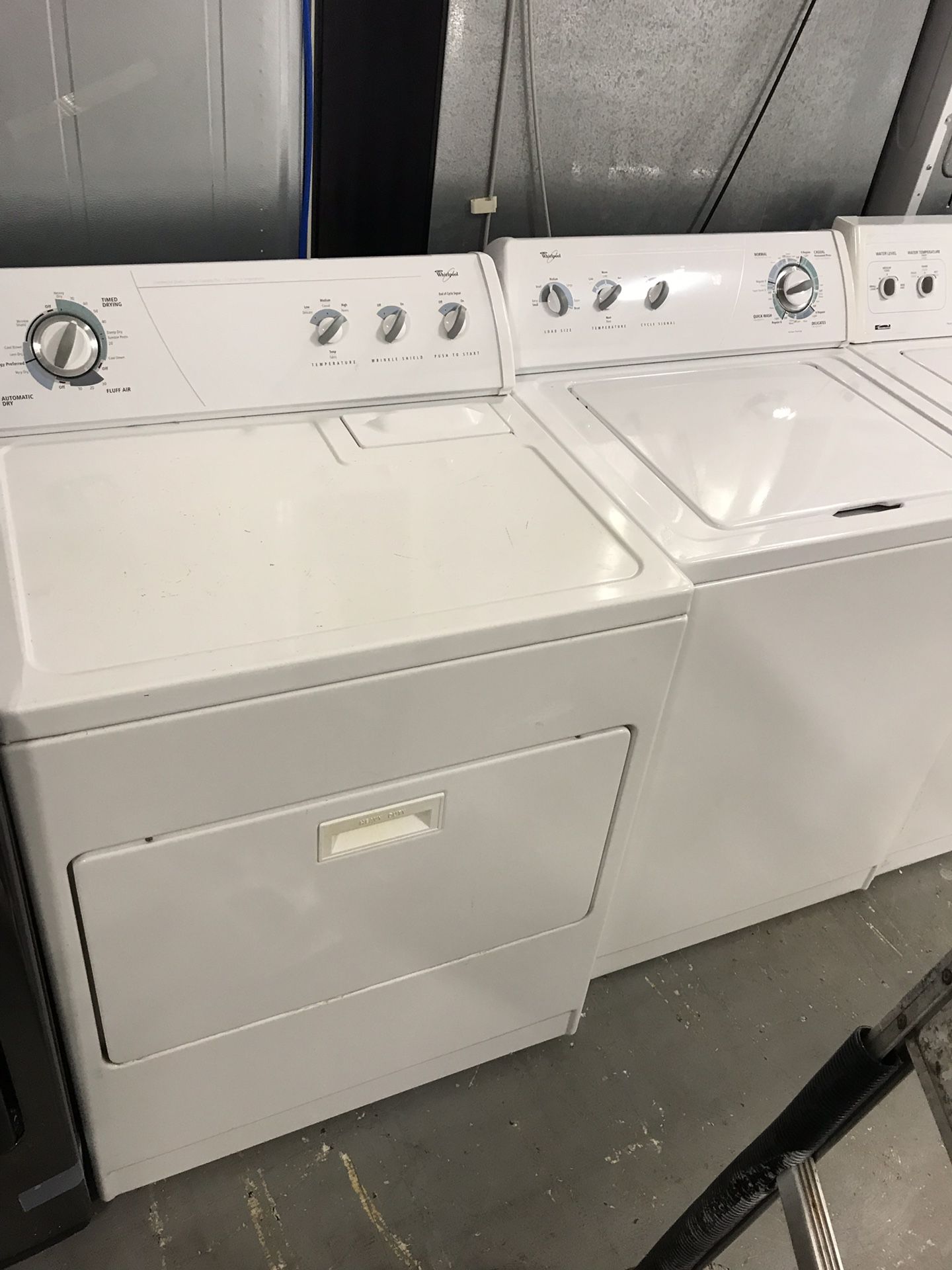 Kenmore brand refurbished top load washer dryer set.