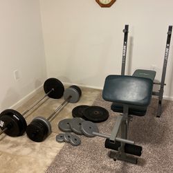 Over 300 pounds of weights with two straight steel bars with bench will accept best offer offer
