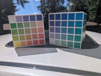 Lot of 2x Sarah Renae Clark Colour Cubes, a creative tool designed to help artists and crafters select color palettes.The cubes contain cards with pre