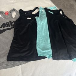 Womens Size Medium Nike/Asidas Tank Tops In Great Condition. All 9 for 60.00.
