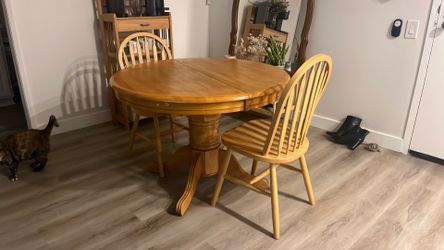 Wooden table with two chairs