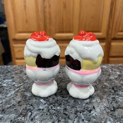 Vintage Ceramic Sundae Pair of Salt and Pepper Shakers.  Size approximately 3 1/2 inches tall.  Preowned.  Has been on display in a cabinet with a ver