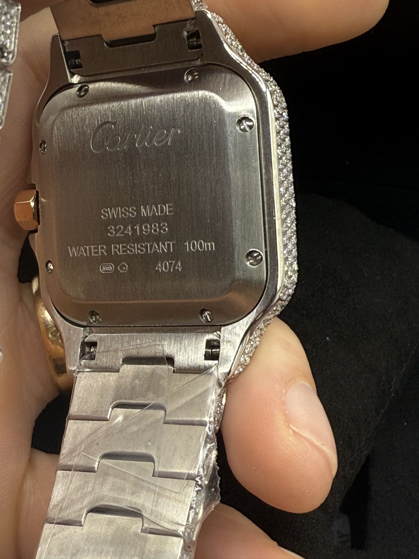 Cartier stainless steel with VVS moissanite and 14K rose gold.