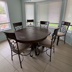 Antique dining room table & 6 modern chairs