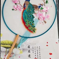 2 New embroidered fan with wooden handles and tassel.