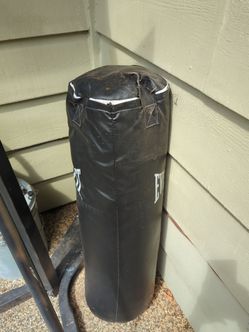 Free punching bag with broken strap.  Stand sold separately