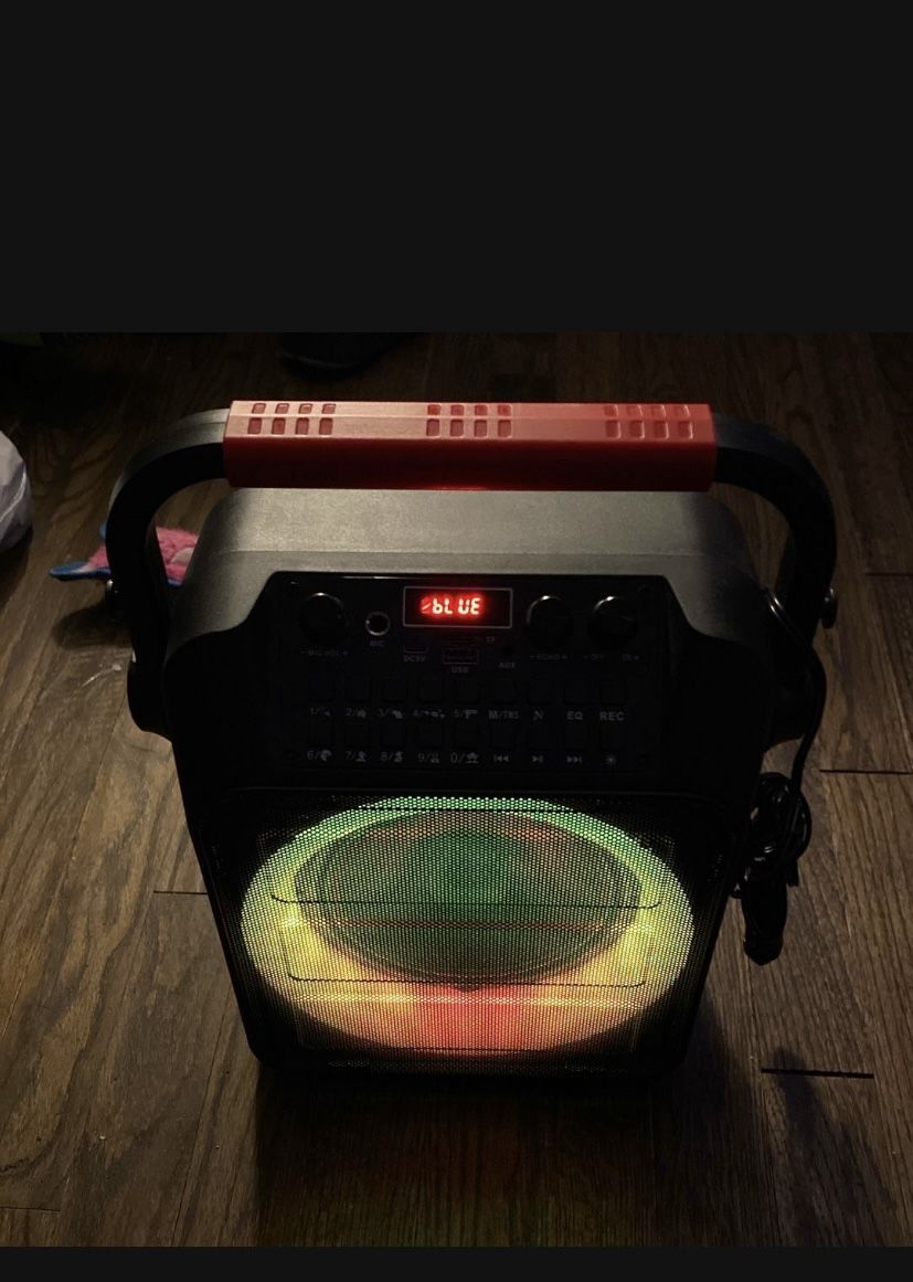 kids karaoke sub lights up has bluetooth great bass comes with charging cord and microphones 1 is wireless not using still like new 60