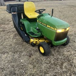 John Deere lx 176 with snow blower deck bagger and tire chains