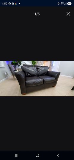 Fauxdark brown leather love seat