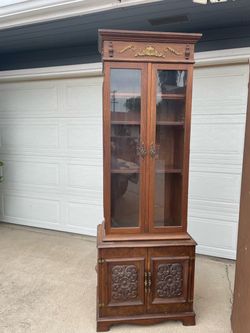 Vintage tall curio cabinet