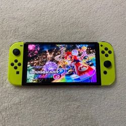 NINTENDO SWITCH OLED with 100 SWITCH GAMES