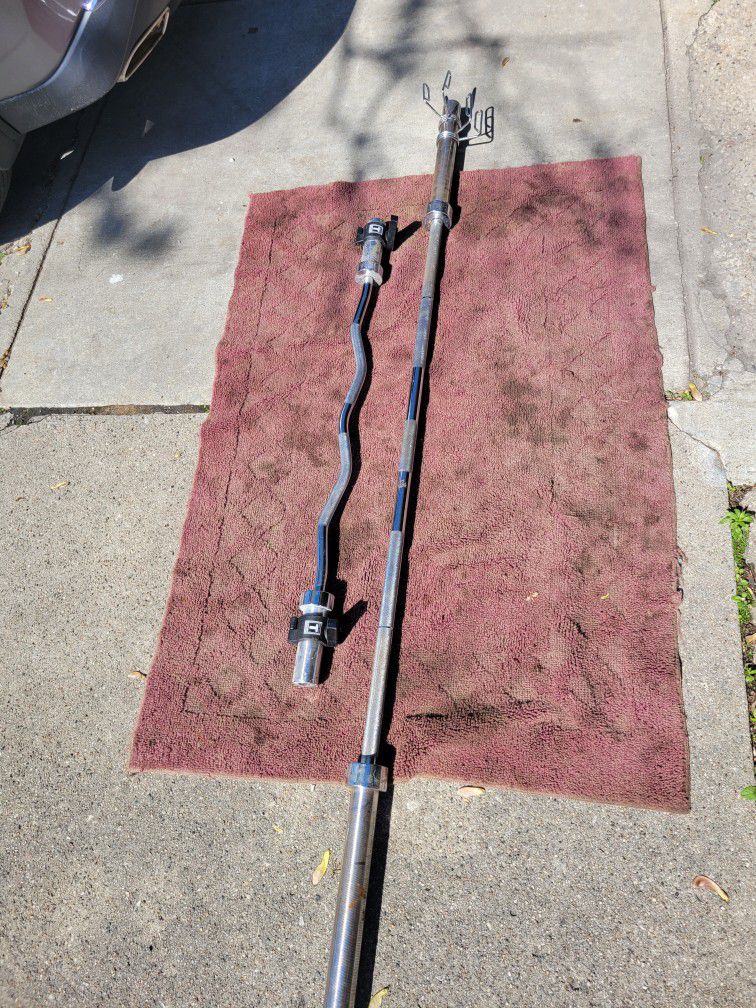 7'   OLYMPIC  2" HOLE  45LB BAR  AND EZ-CURL BAR 
7111. S. WESTERN WALGREENS 
$130  CASH ONLY AS IS