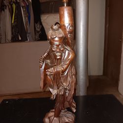 Vintage fisherman wooden statue