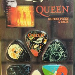 New Queen 6 collectible guitar picks - plastic package is discolored yellow but has never been opened 