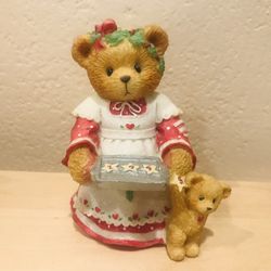 cherished teddies"Amanda"girl holding cookie tray marked 1995.bear next to her.