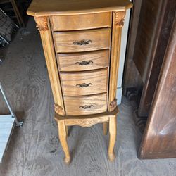 jewelry cabinet in good condition its 36 inches tall 13 inches wide and 11 inches deep