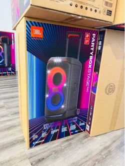 New JBL PartyBox Stage 320 portable speaker. This black unit has a telescopic handle and sturdy wheels for easy transport. It features a futuristic li