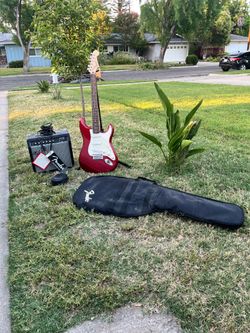 Starter electric guitar guitar case amp tuner and cables