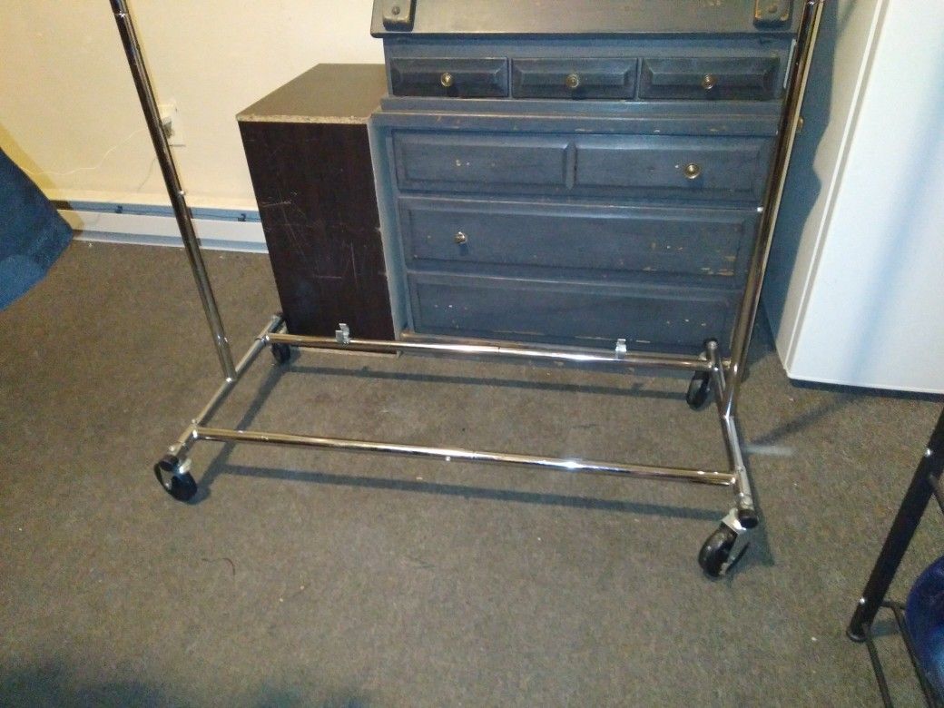 Clothing Rack On Wheels With Adjustable Slots