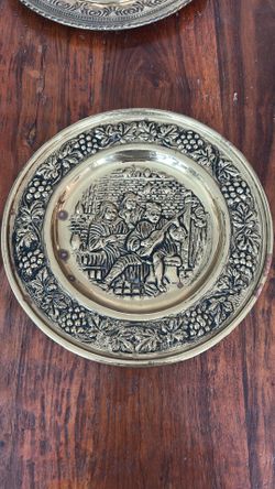 vintage, hammered brass wall plate from England depicts a tavern scene