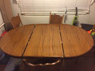 Solid Oak dining room table with chairs