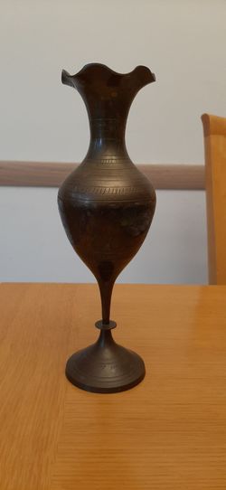 vintage brass vase with intricate engravings