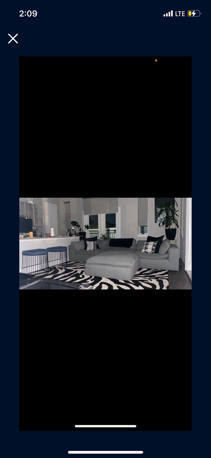 Rug couch, pillows, another rug