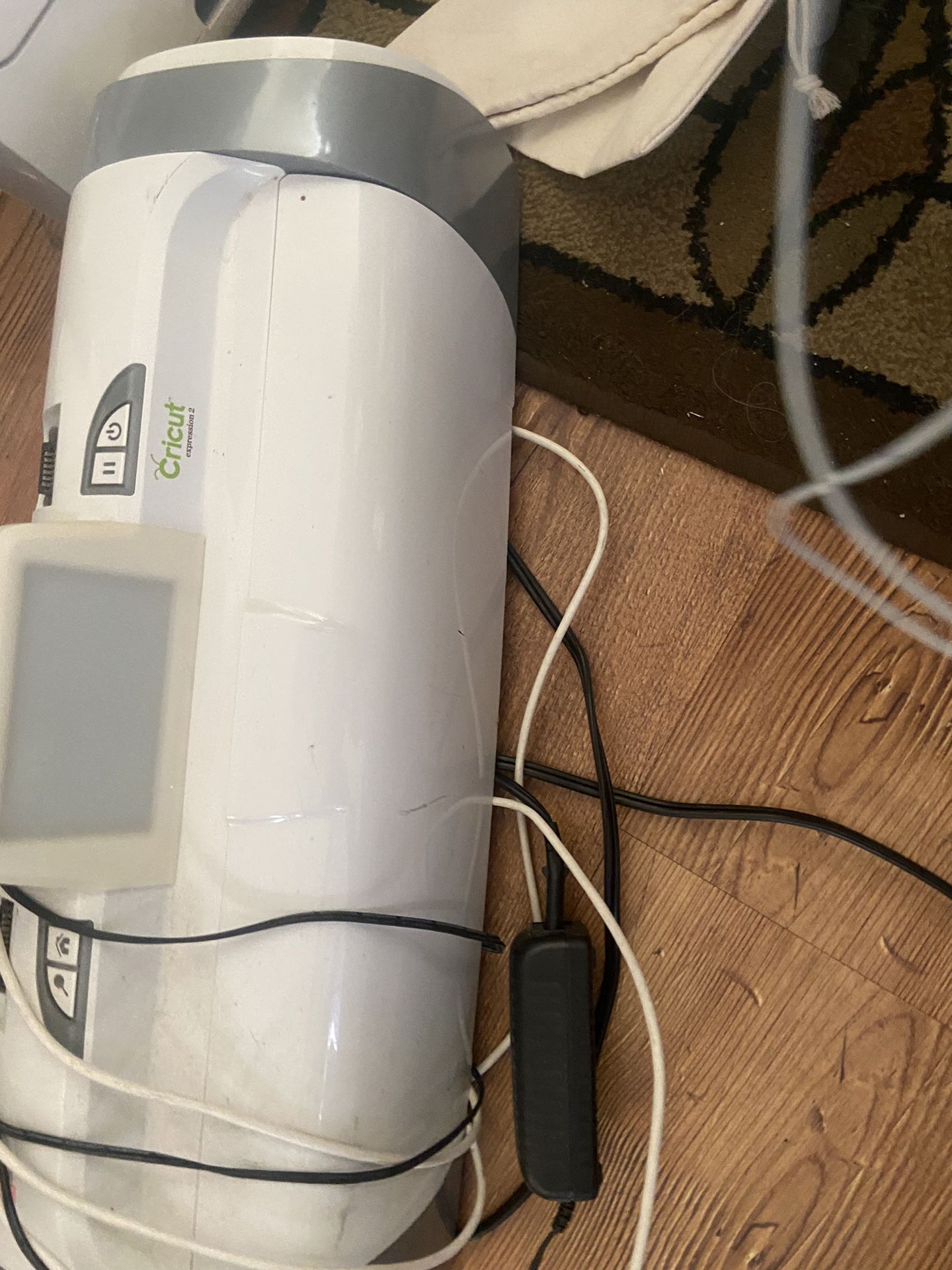 Two Cricut Machines, Large Box Of Permanent Vinyl, Roll Of Vehicle Grade Laminate, Heat Press Tape, Corrugated Cardboard And Much More