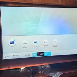 55" Samsung TV with Remote and wall bracket.