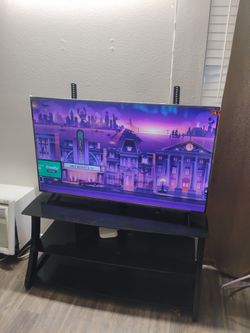 55 smart TV like new with stand (no remote)