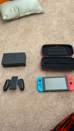 nintendo switch with box, case, controller and mario kart 8 deluxe