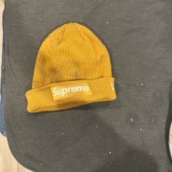 Supreme x New Era Box Logo Beanie in the "Mustard" or "Light Mustard" colorway. 