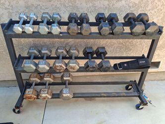 610 lb.   Dumb Bells  / rack