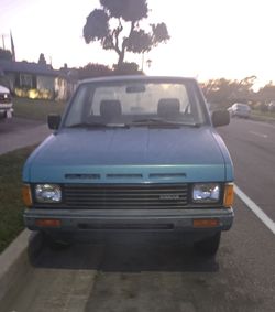 1986 Nissan Pickup.. plates up to date