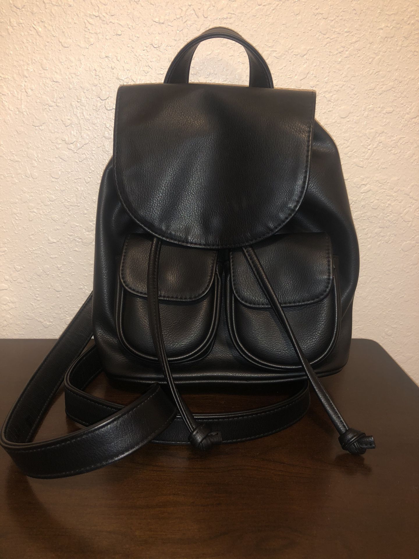Small black leather backpack