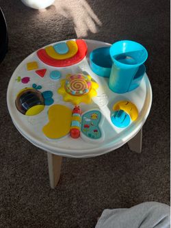 Baby table lights up and plays music
