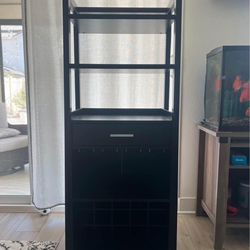 Nice wine cabinet, dark brown color, Three layers for display One draw And one lay for glasses One lay for wine